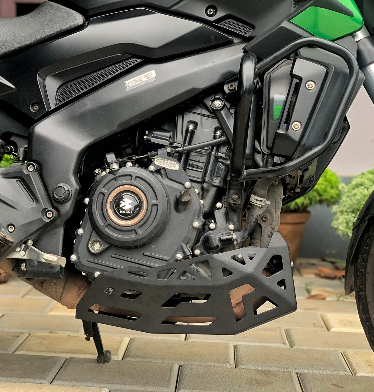 Jorjem International bash plate for Dominar 250 and 400 motorcycle, durable metal shield installed under the bike.