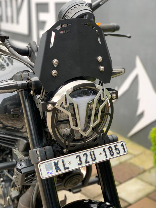 Ronin metal visor from Jorjem International Pvt Ltd, showing a sleek, silver Tvs Ronin helmet visor with detailed design.