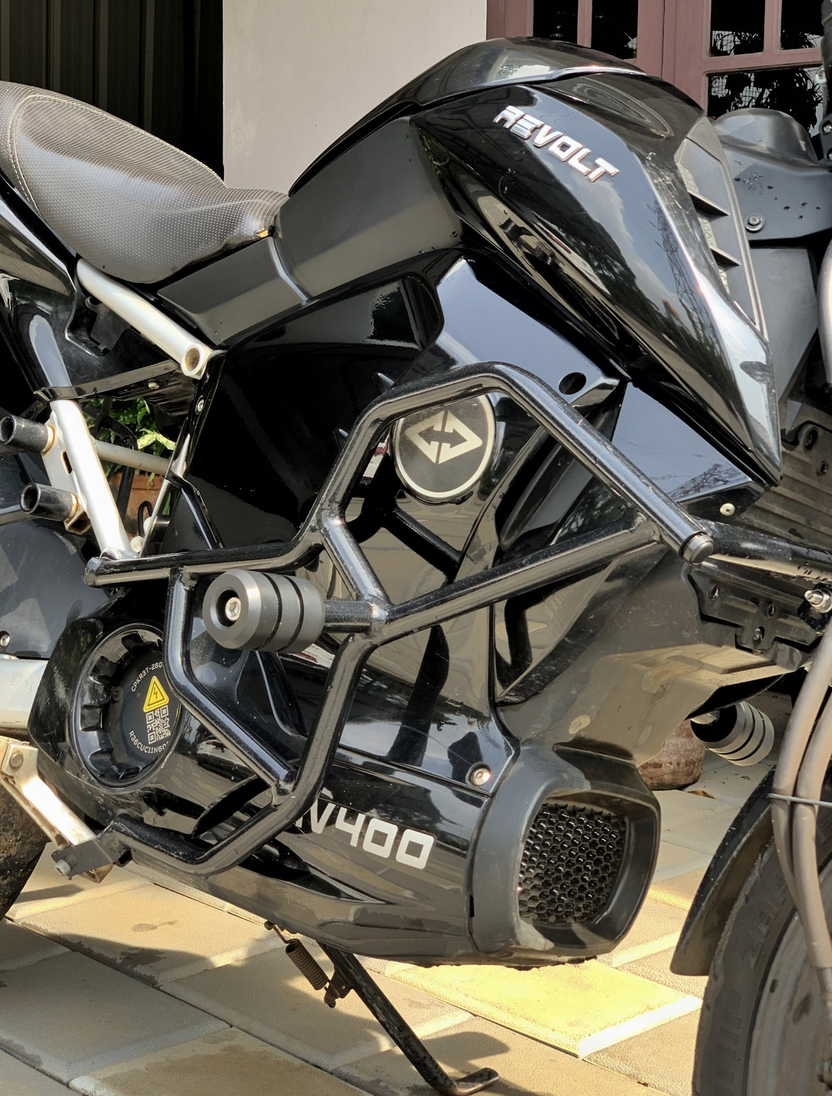 Jorjem Revolt RV 400 crash guard with sliders, showcasing durable design and sleek finish for motorcycle protection.