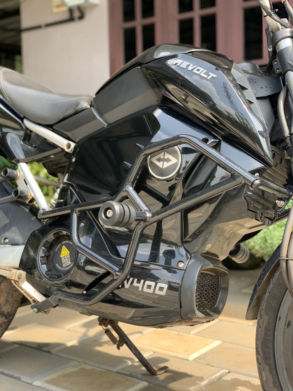 Jorjem Revolt RV 400 crash guard with sliders installed on a motorcycle, showcasing durable design and protective features.