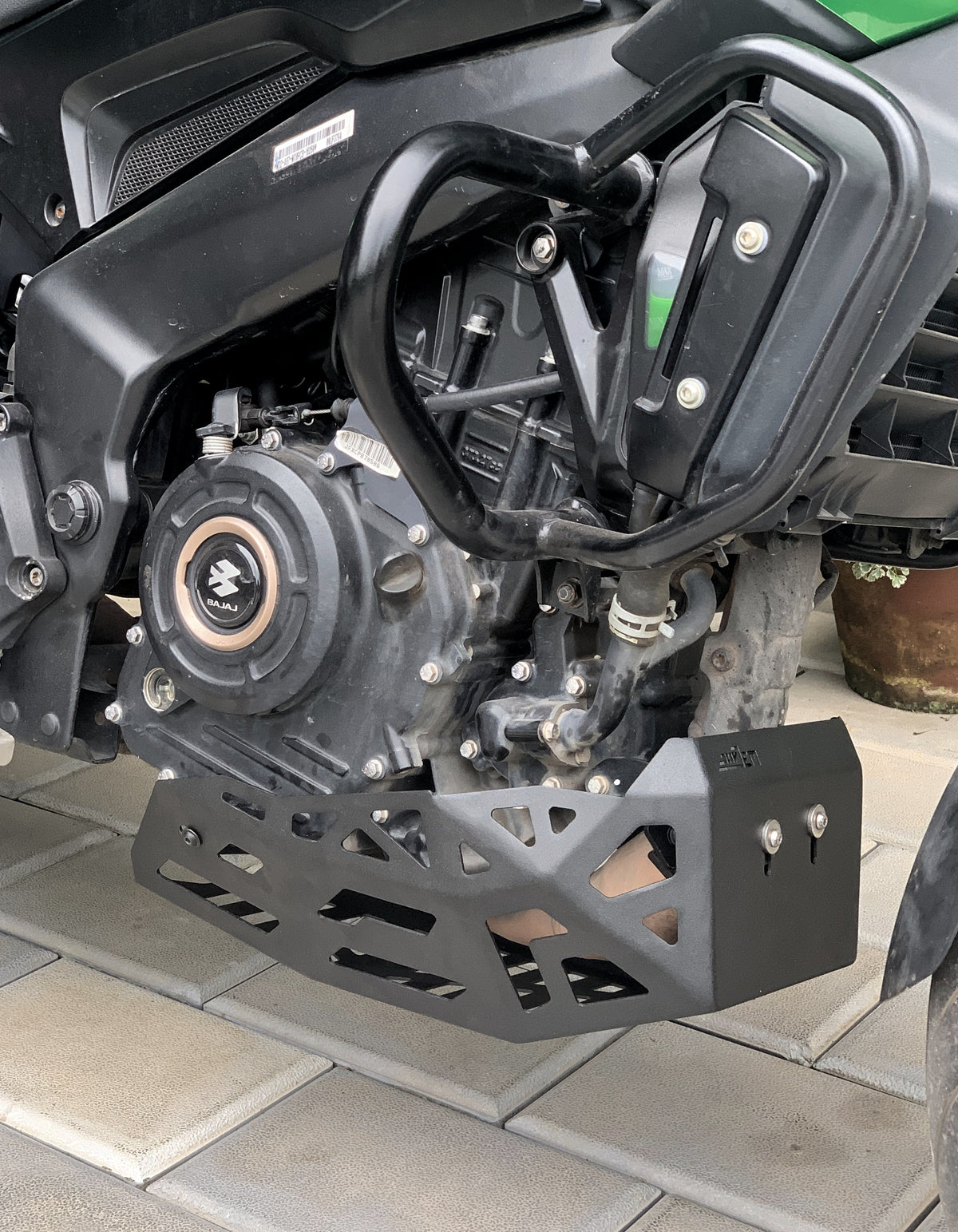 Jorjem International bash plate for Dominar 250/400 motorcycle, black protective undercarriage part, mounted beneath the engine.