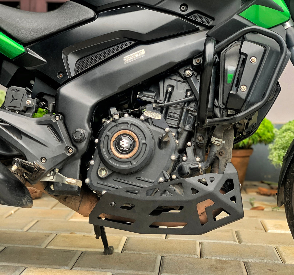 Jorjem International bash plate for Dominar 250 and 400 motorcycles, durable metal protection for engine underside.
