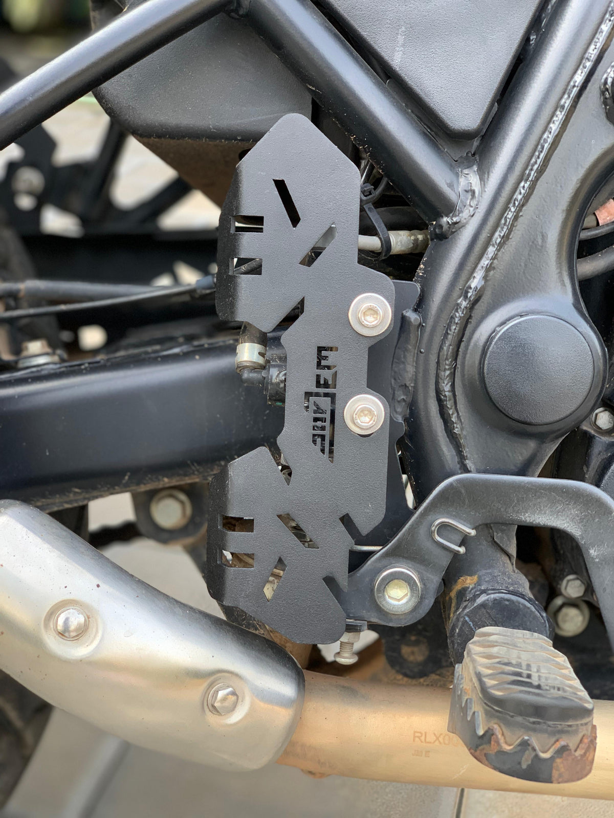 Jorjem International Himalayan Scram 411 master cylinder guard, durable metal protection for motorcycle brake system.