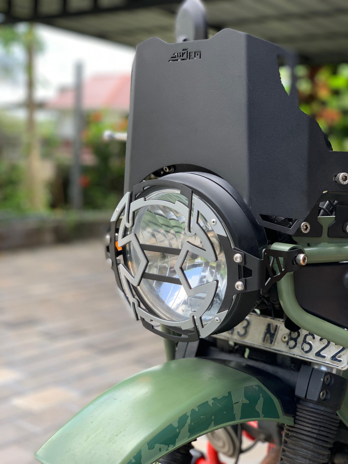 Himalayan 411 headlight grill by Jorjem International Pvt Ltd, showing a black metal front grille for vehicle headlights.