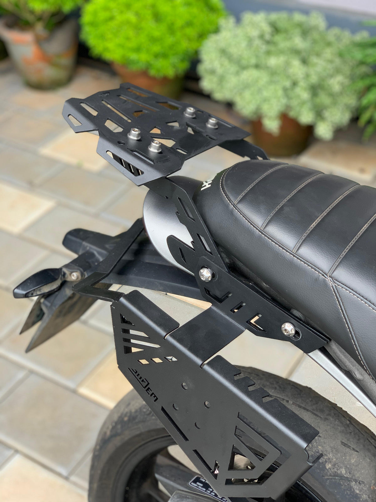 Triumph Speed 400 luggage carrier by Jorjem International, showcasing a robust design for secure motorcycle storage.