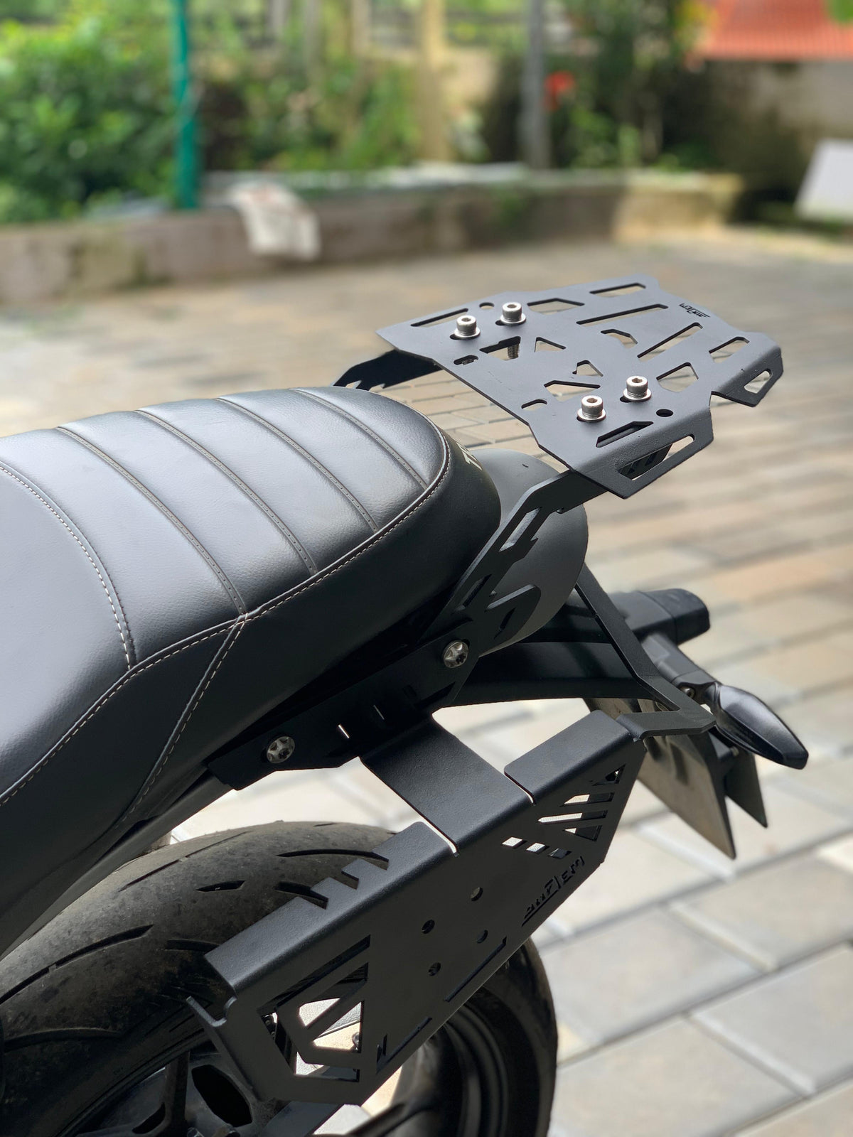 Triumph Speed 400 luggage carrier from Jorjem International, showcasing durable design and mounting features.