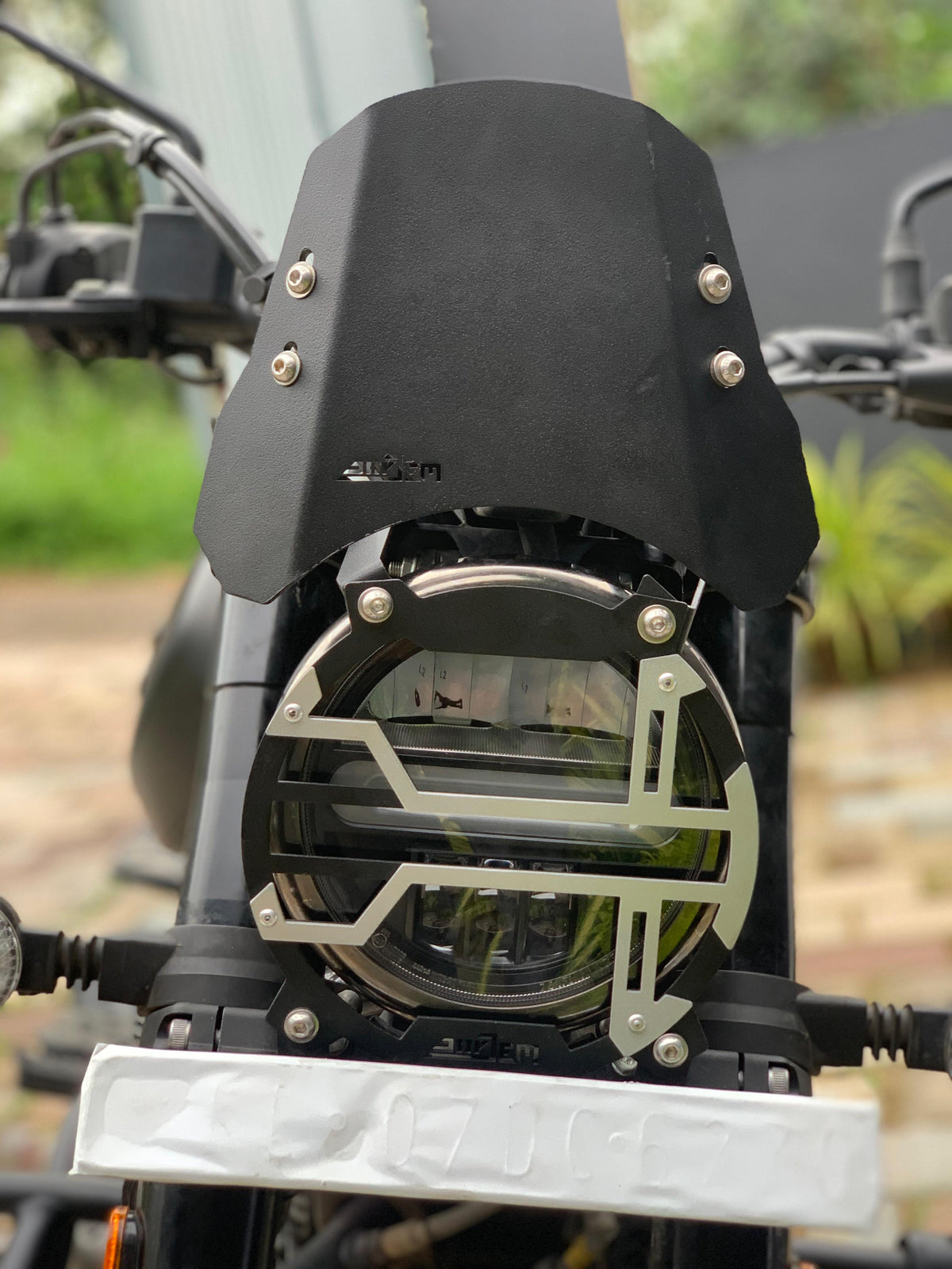 Harley X440 headlight grill by Jorjem, featuring a sleek design and durable construction for motorcycle styling.