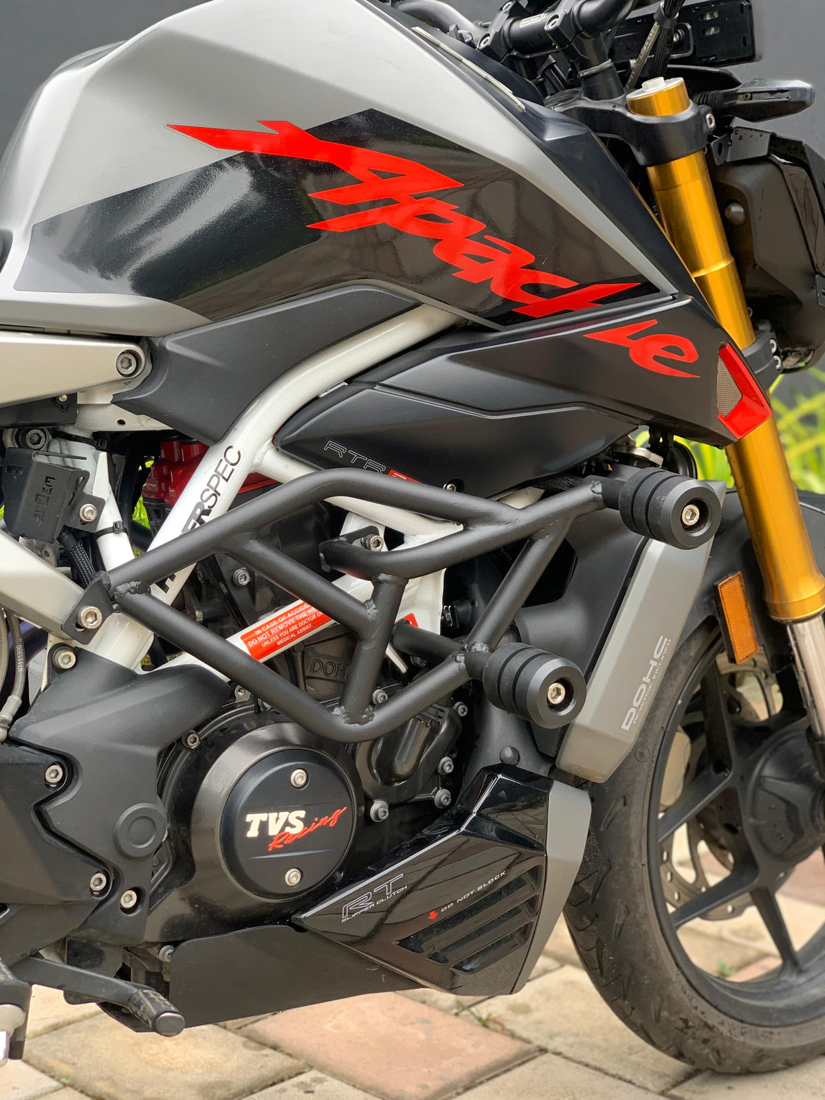 Jorjem International Pvt Ltd RTR 310 crash guard mounted on motorcycle, showing durable metal protective bar for motorcycle safety.
