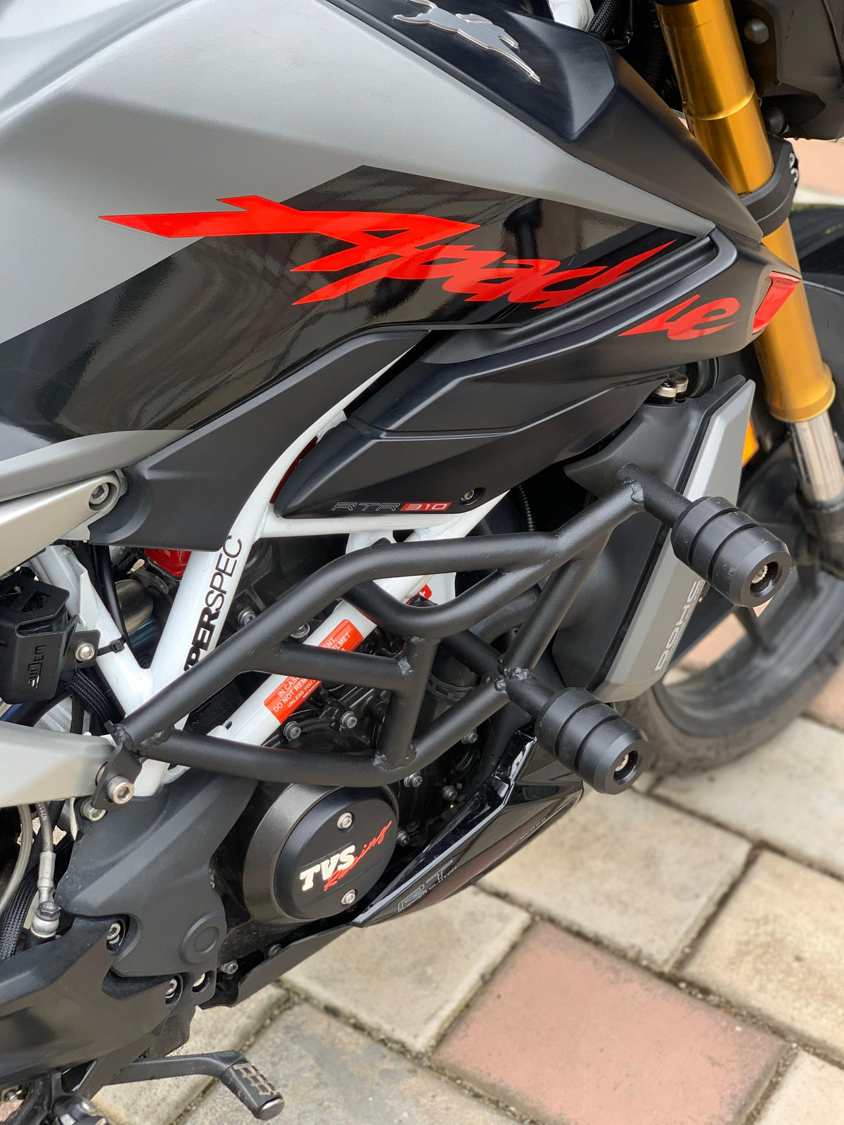Jorjem International Pvt Ltd RTR 310 crash guard installed on motorcycle, durable metal protection for rider safety.