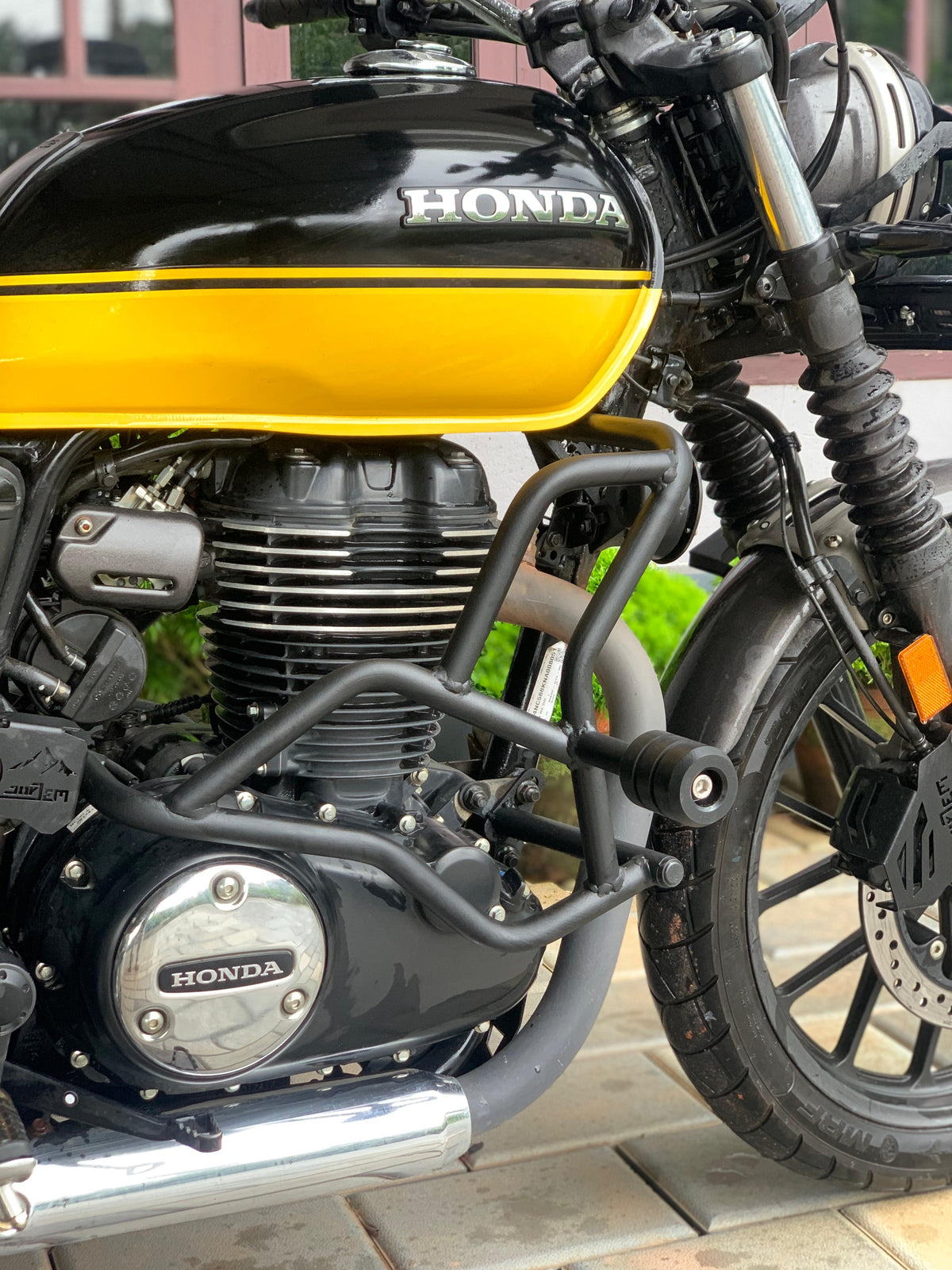 Jorjem CB350RS crash guard by Explore Manufactures, showcasing sturdy metal construction and sleek design for motorcycle protection.