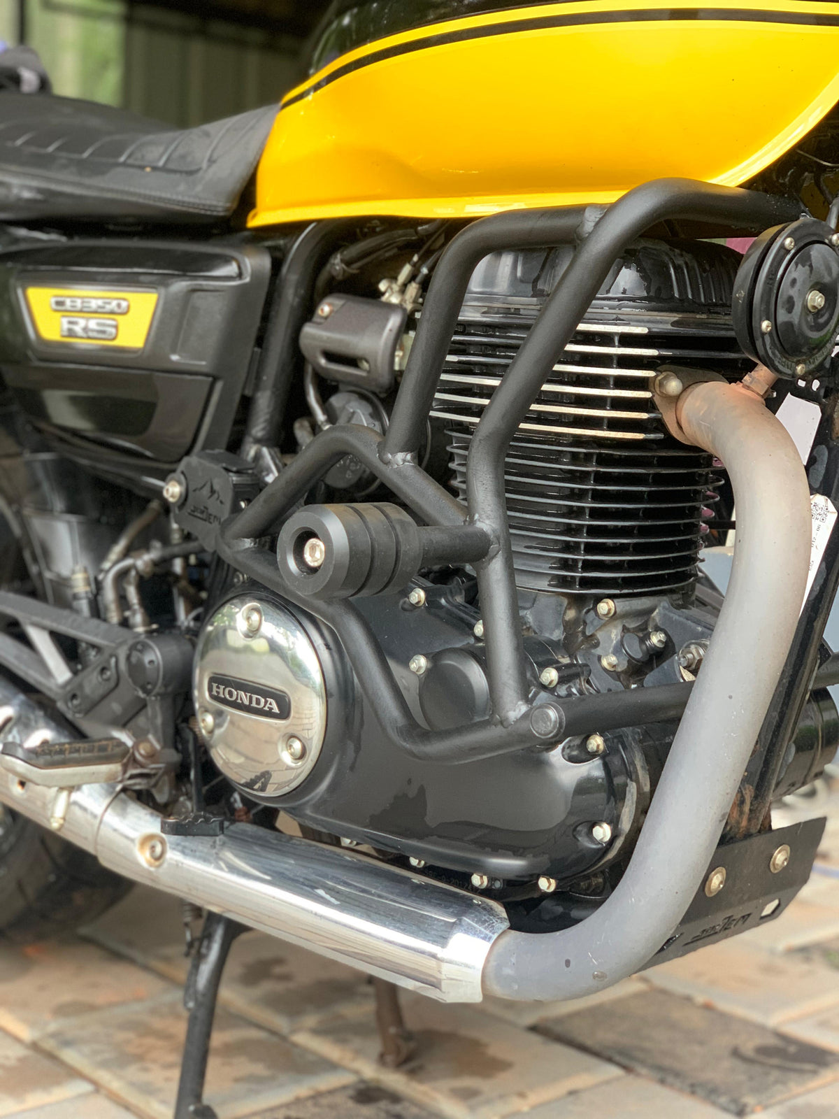 Jorjem CB350RS crash guard by Explore Manufactures, featuring robust metal construction for enhanced motorcycle protection.