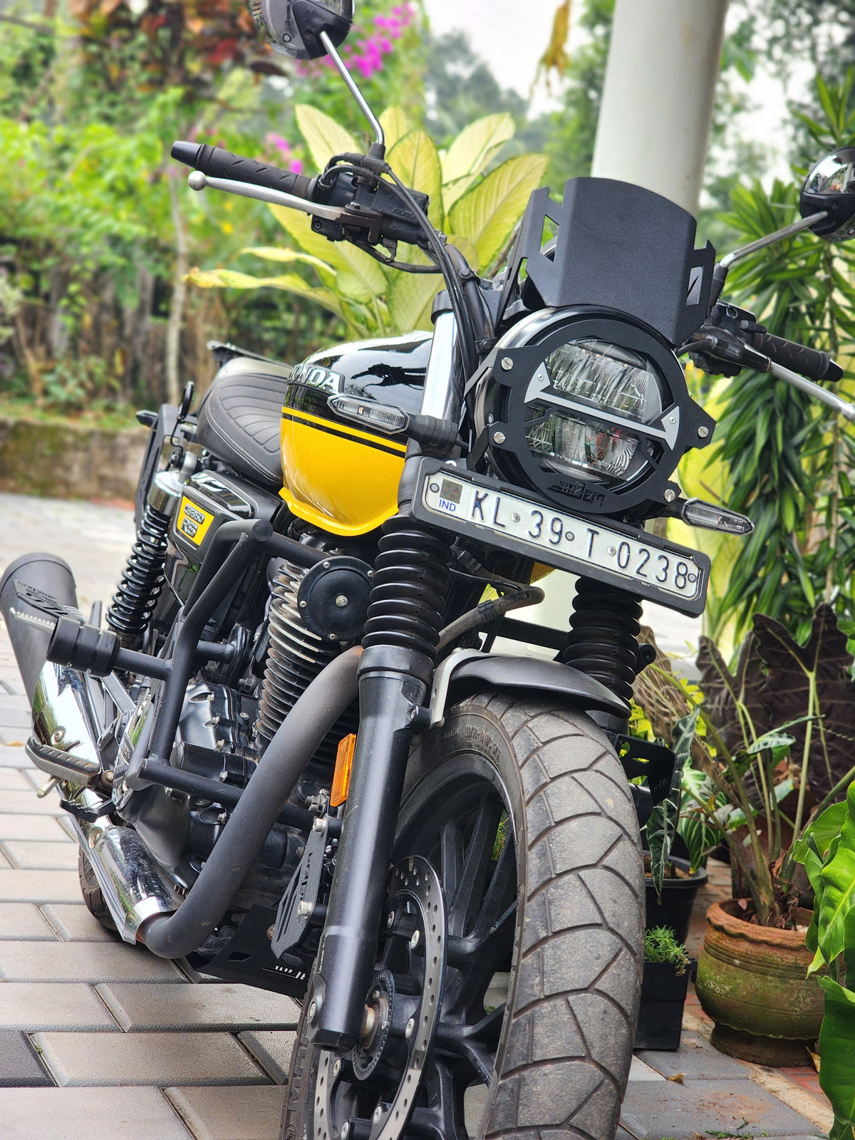 Explore Manufactures Jorjem CB350RS metal visor mounted on a motorcycle helmet, showcasing a durable, shiny metallic finish.
